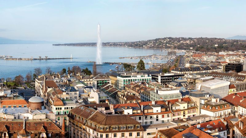 City view of Geneva overlooking the old town rooftops, Lake Geneva and the Jet d’Eau.