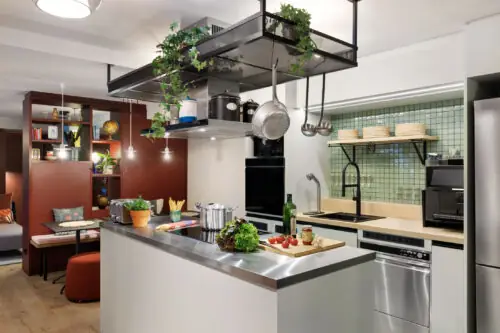 Fully equipped community kitchen with stove, oven, coffee machine, dishes and cooking utensils