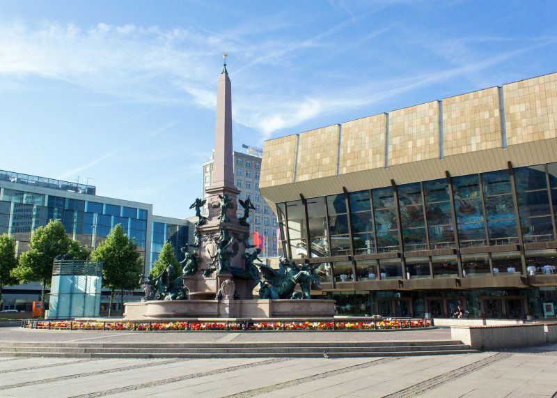 Augustusplatz in Leipzig with the Mendebrunnen fountain and opera house—a vibrant meeting point of culture, architecture, and city life.